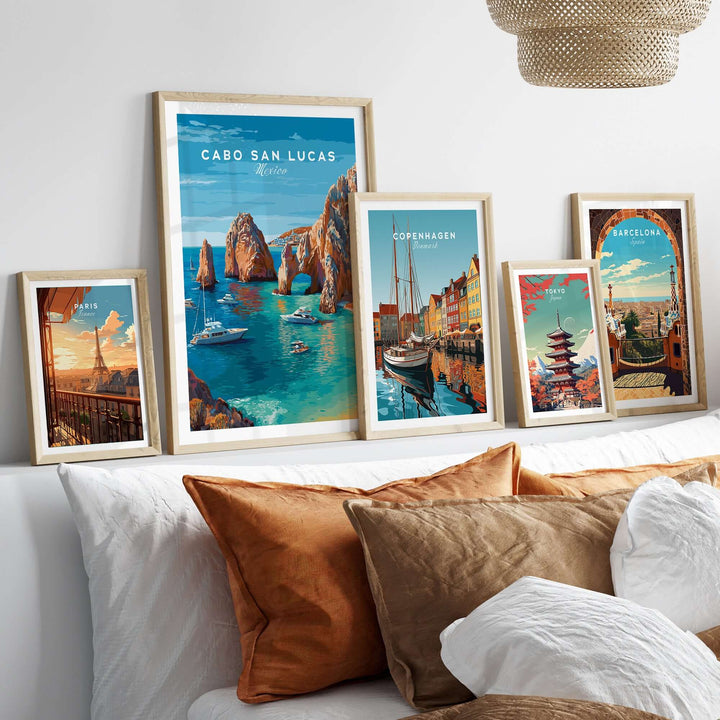 Cabo San Lucas travel posters featuring El Arco, boats, and scenic landscapes displayed in a stylish home interior.