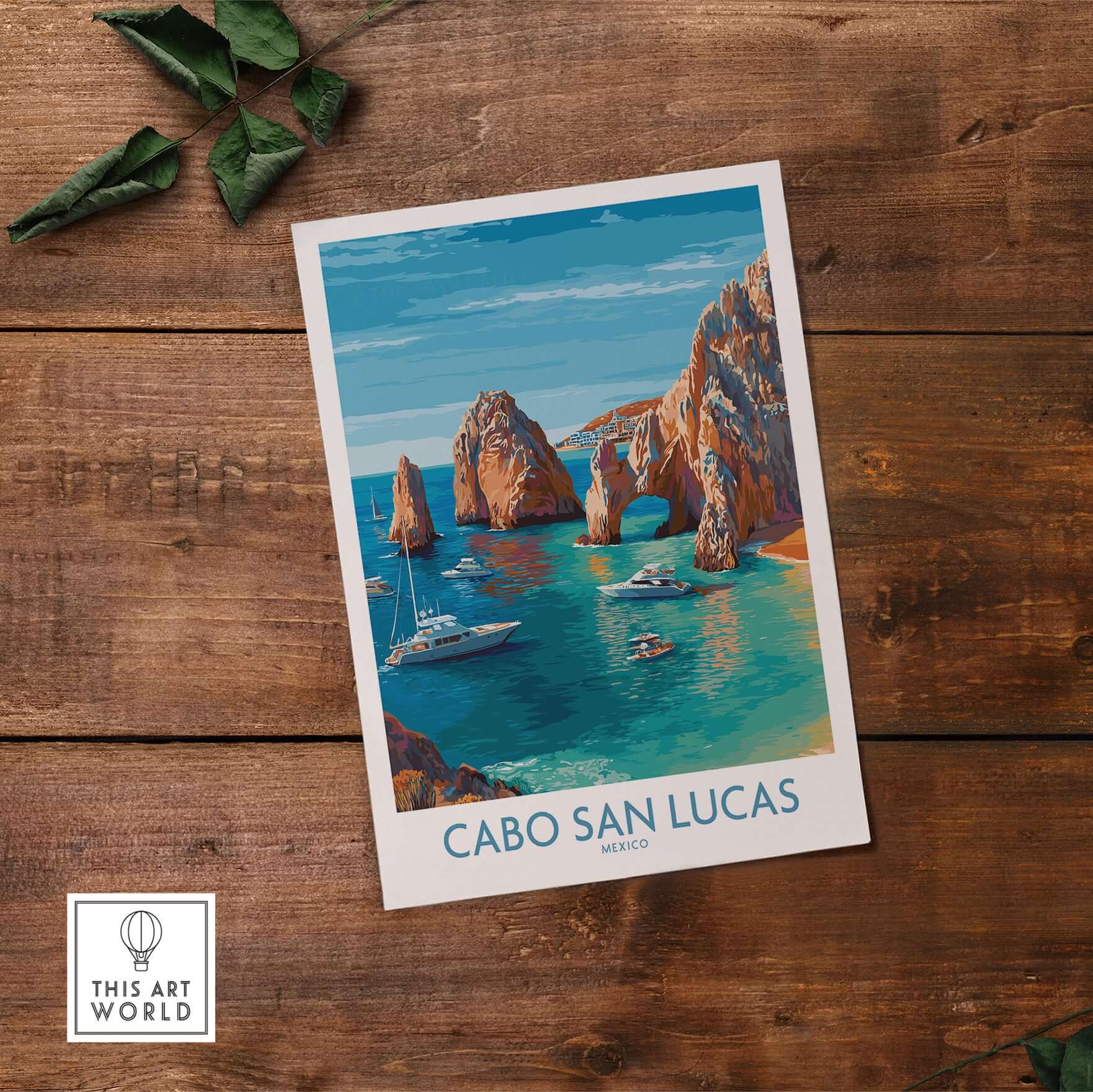 Cabo San Lucas Mexico Travel Poster El Arco Boats Turquoise Water Print Wall Art on a wooden table.