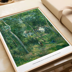 Exhibition Art Print Camille Pissarro Edge of the Woods Impressionist Landscape Poster Wall Art displayed on a table.
