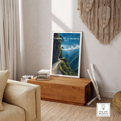 Camino de la Muerte Poster Bolivia Wall Art displayed in a stylish living room setting on a wooden table.