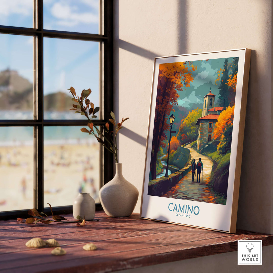 Camino de Santiago Autumn Path Art Print | Pilgrim Trail Travel Poster displayed on a wooden shelf with a scenic view.