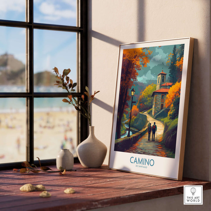 Camino de Santiago Autumn Path Art Print | Pilgrim Trail Travel Poster displayed on a wooden shelf with a scenic view.