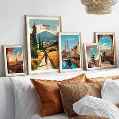 Camino de Santiago Mountain Chapel View Print | Rustic Travel Wall Art displayed among other travel artwork on a cozy bed.