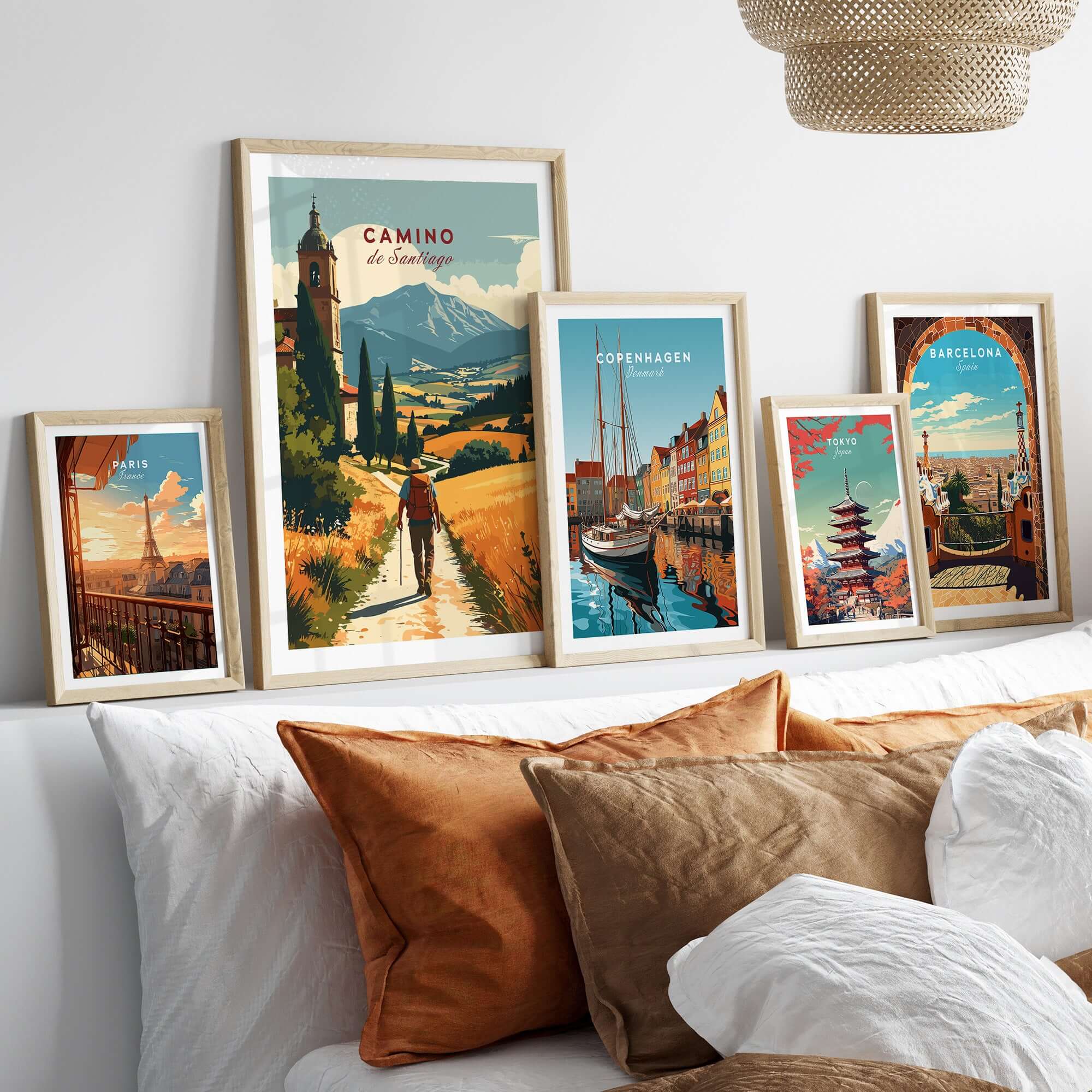 Camino de Santiago Mountain Chapel View Print | Rustic Travel Wall Art displayed among other travel artwork on a cozy bed.