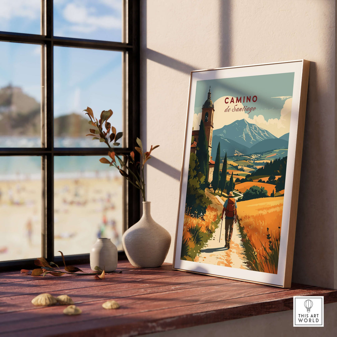 Camino de Santiago Mountain Chapel View Print | Rustic Travel Wall Art displayed in a bright room with a view of the beach.