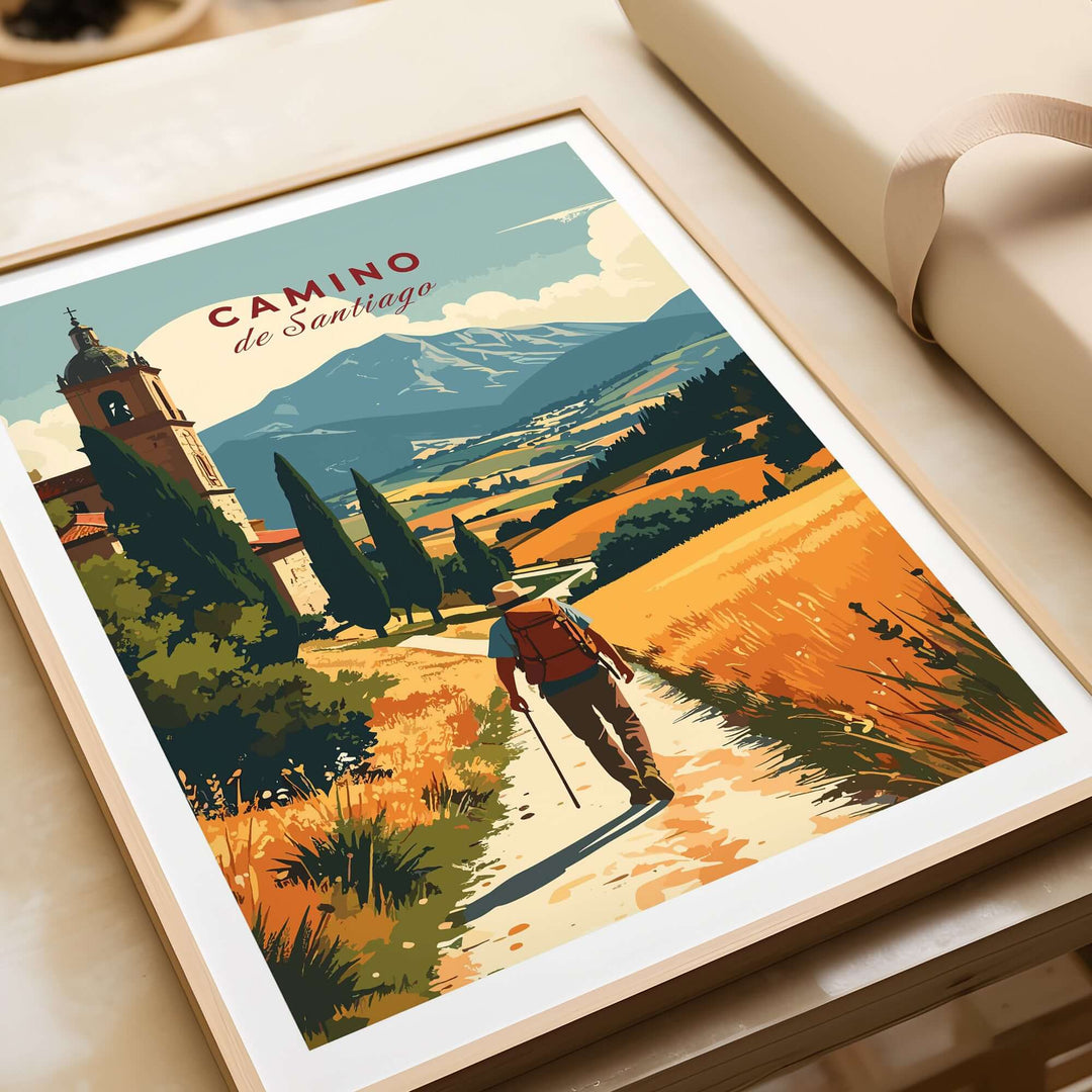 Camino de Santiago Mountain Chapel View Print | Rustic Travel Wall Art features a hiker on a scenic path with mountains.