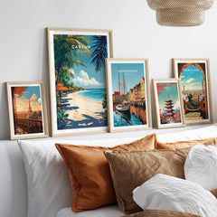 Cancun Print travel poster displayed among other city posters in a stylish home decor setting.