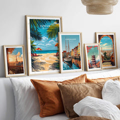 Wall featuring Cancun Travel Print and other city poster prints in colorful frames.