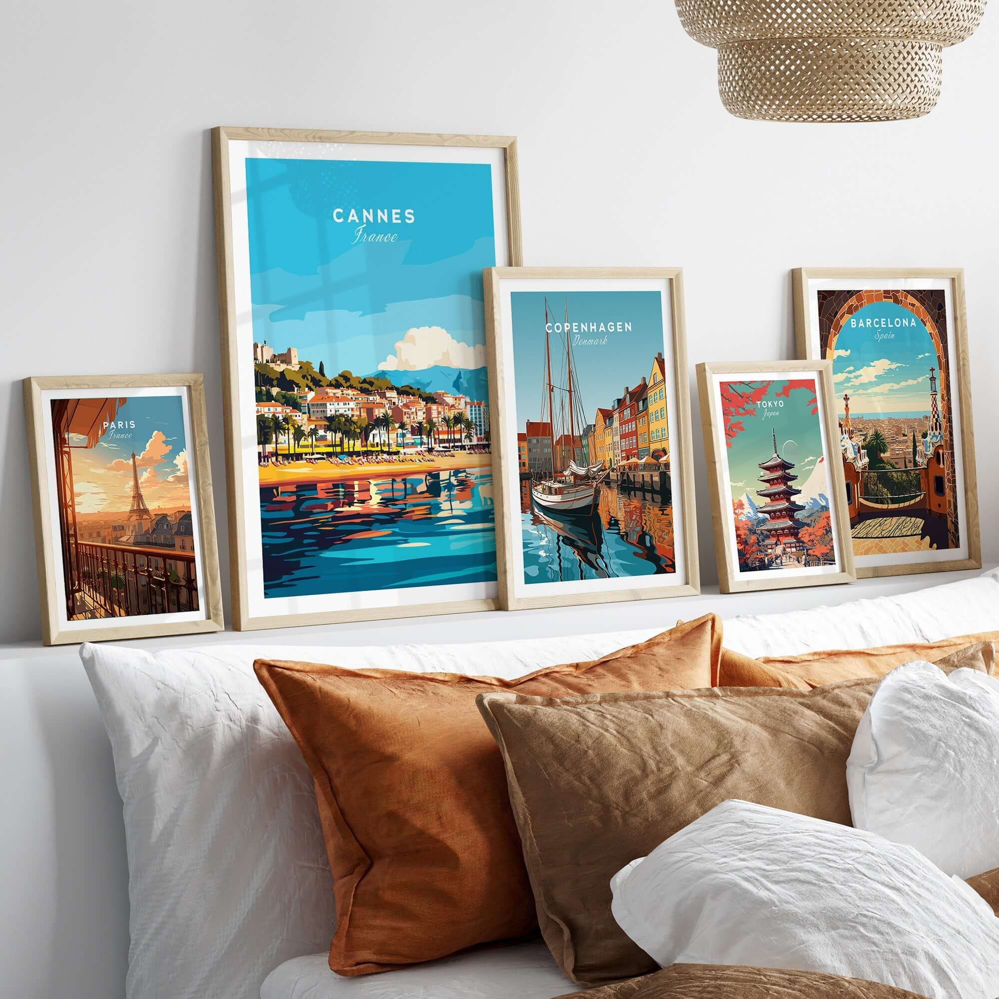 Cannes Wall Art displayed on a modern wall, featuring vibrant depictions of Cannes and other cities.