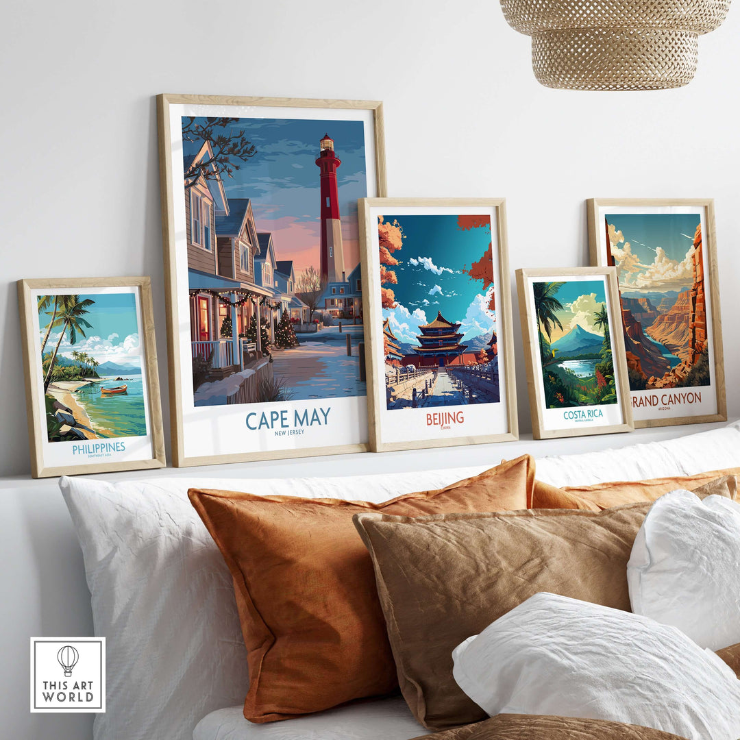 Five vibrant travel posters including Cape May Christmas Lights displayed on a cozy sofa.