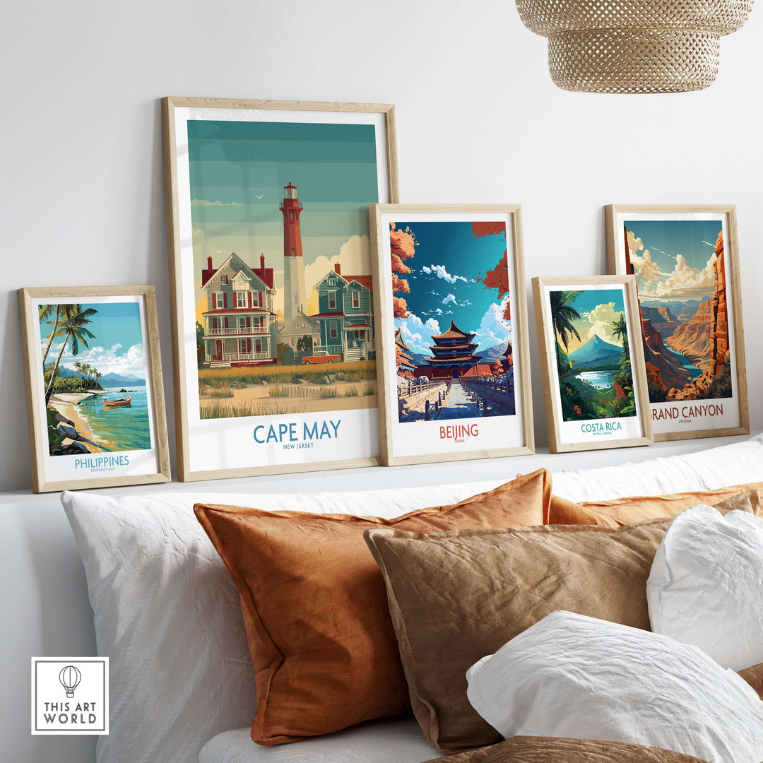 Cape May Historic District wall art and travel-themed prints on a modern shelf with decorative pillows.