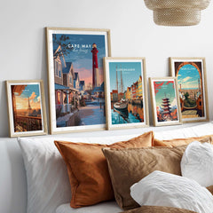 Cape May New Jersey Christmas Lights Wall Art Print and other city art prints displayed on a cozy sofa.