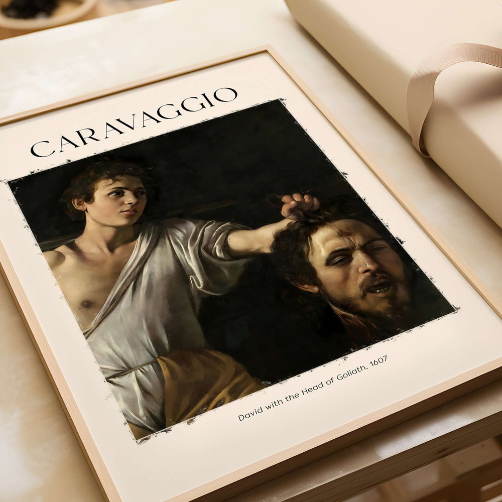 Caravaggio Art Print - David with the Head of Goliath Poster 1607 displayed in a frame, baroque art style.