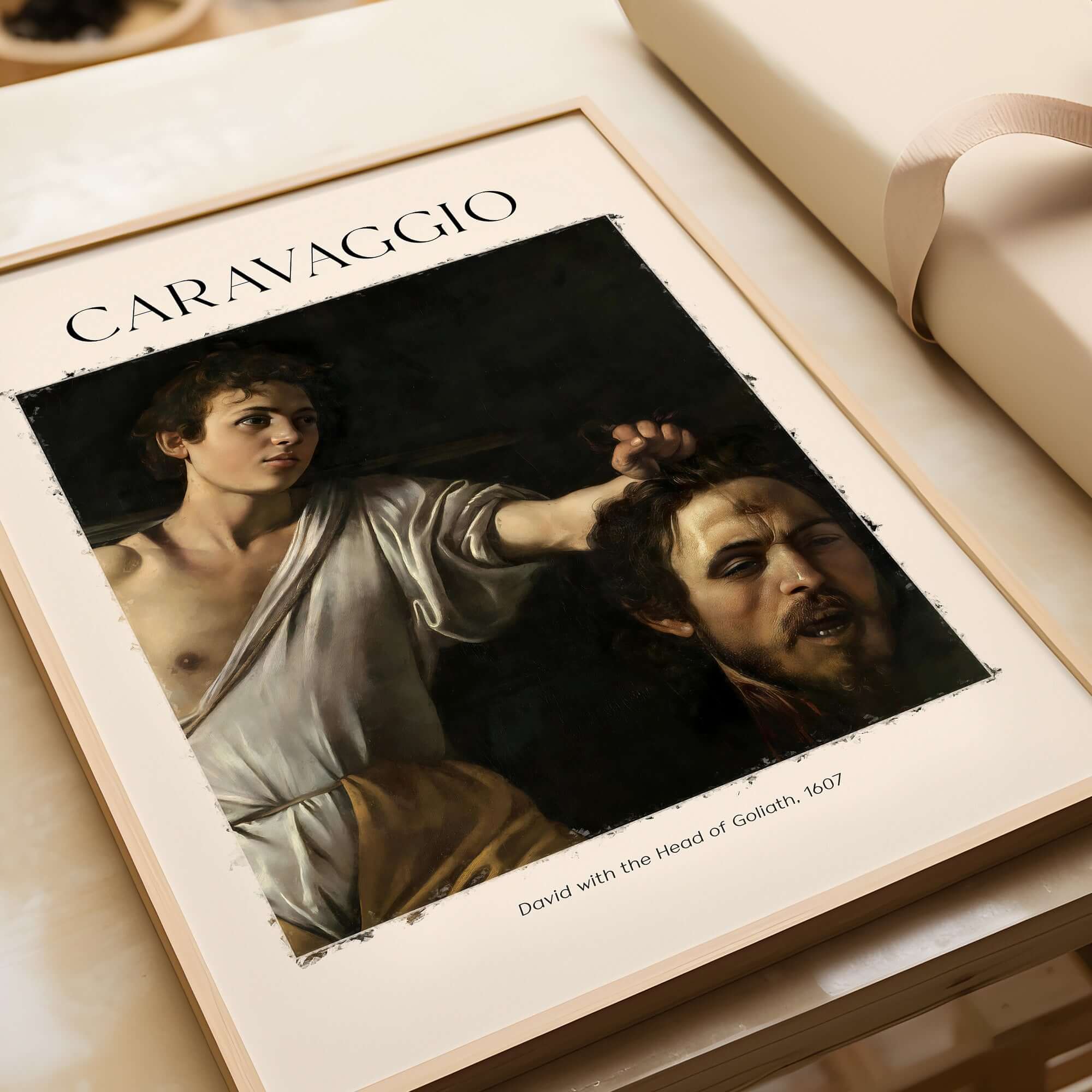 Caravaggio Art Print - David with the Head of Goliath Poster 1607 displayed in a frame, baroque art style.