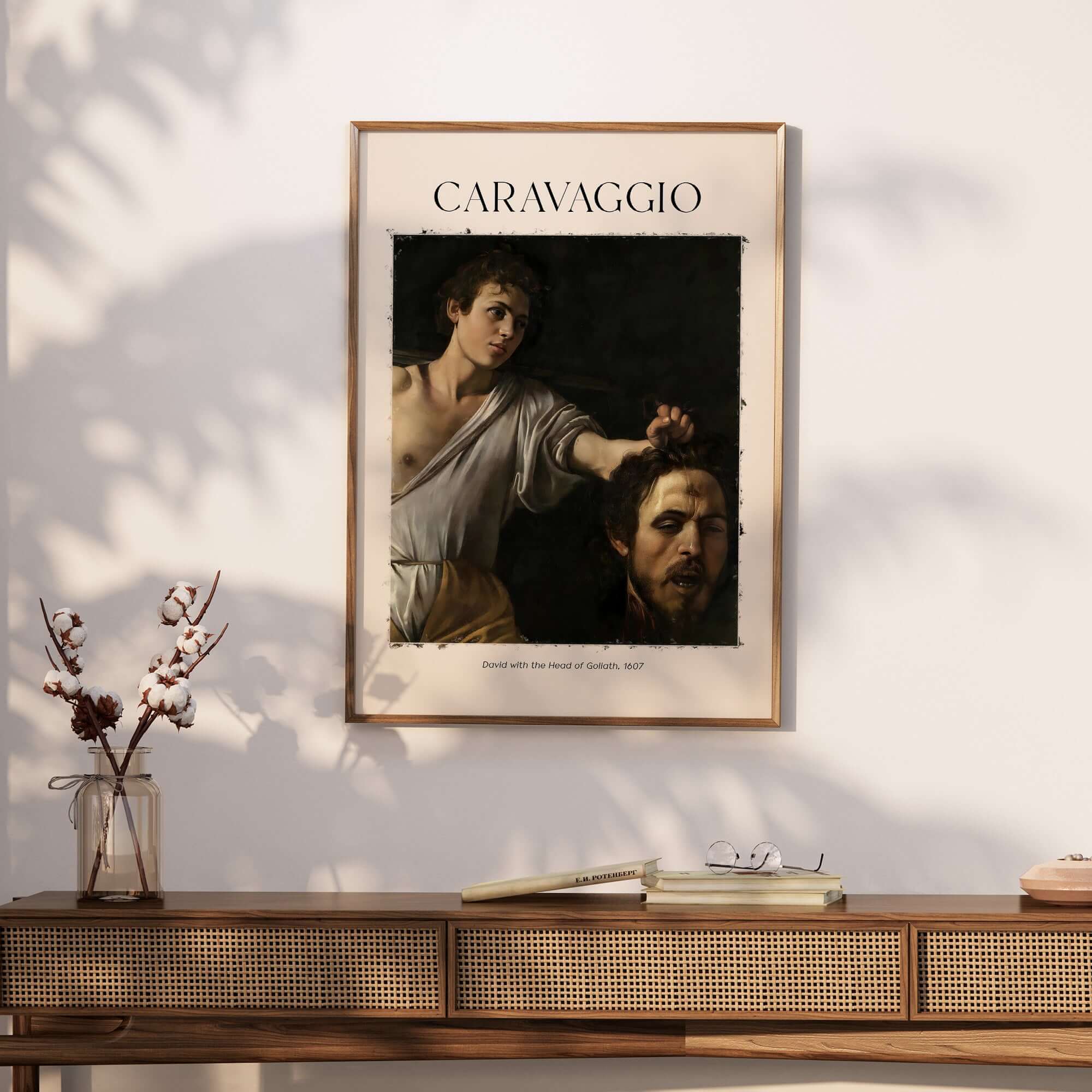 Caravaggio Art Print - David with the Head of Goliath Poster 1607 framed on a wall, showcasing Baroque art.