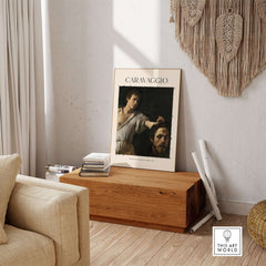 Caravaggio Art Print - David with the Head of Goliath Poster 1607 displayed in a modern living room setting.