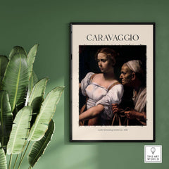Caravaggio Art Print - Judith Beheading Holofernes Poster 1598 framed on green wall with plants
