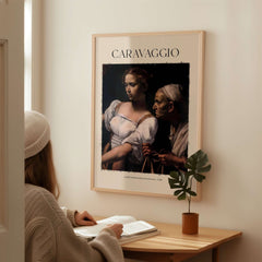 Caravaggio Art Print - Judith Beheading Holofernes Poster 1598 displayed in a modern interior setting.