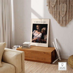 Caravaggio Art Print - Judith Beheading Holofernes Poster 1598 displayed in a stylish living room setting.