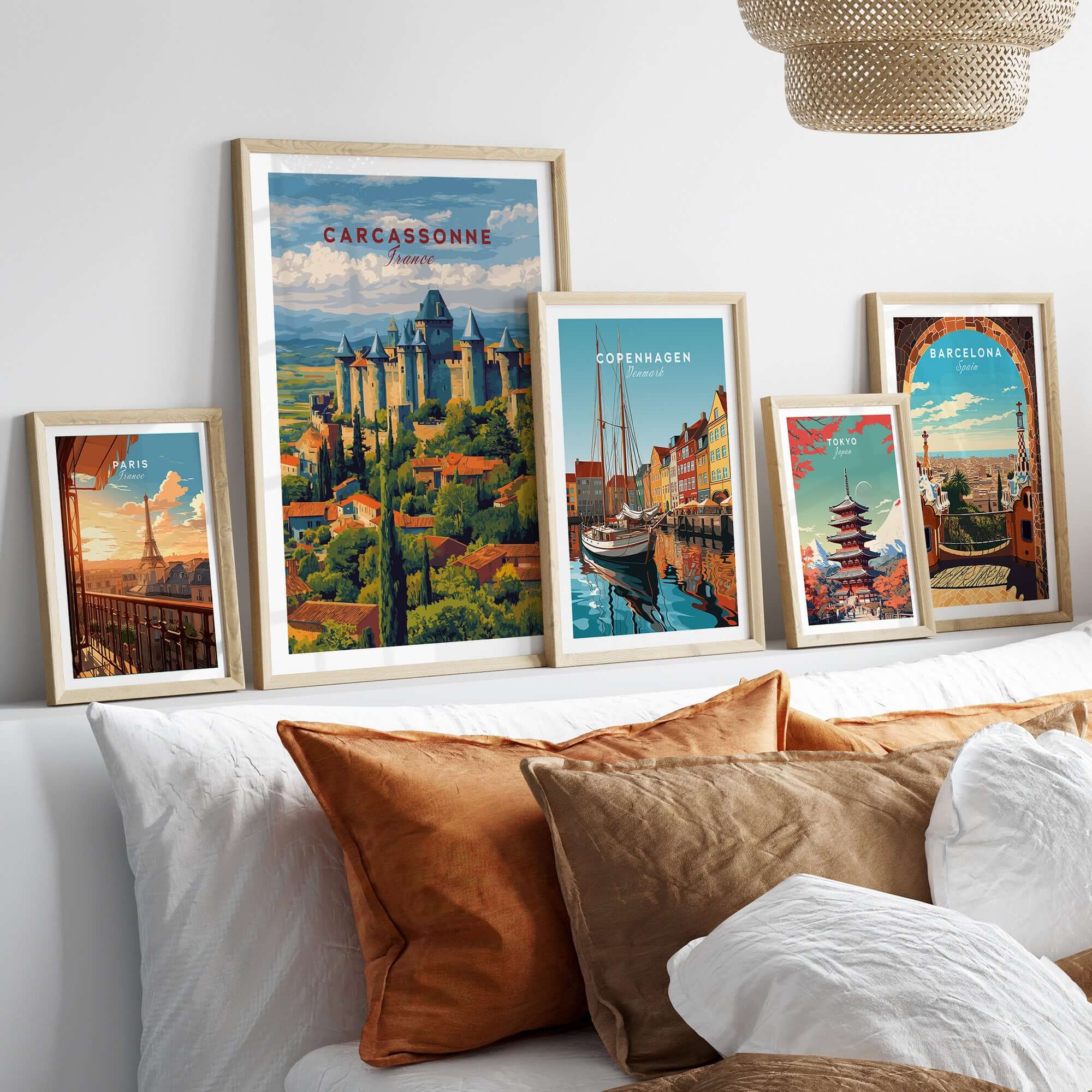 Carcassonne France Medieval Castle Poster - Historic City Wall Art displayed among other travel posters on a stylish sofa.