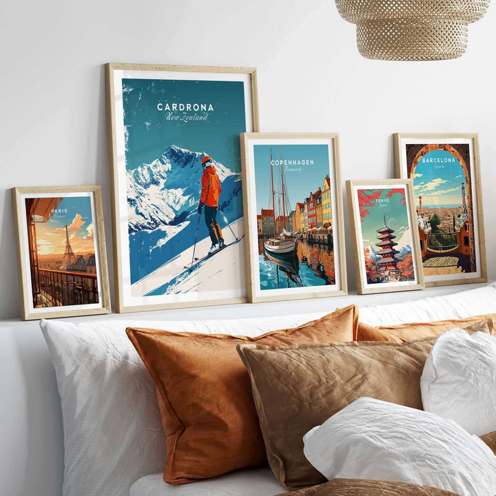 Cardrona Travel Poster featuring ski resort design, framed art prints, and decorative pillows in a stylish interior setting.