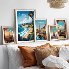Carlsbad Print California displayed in framed art collection on a stylish bed with decorative pillows.