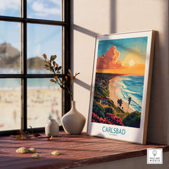 Carlsbad Travel Poster displayed on a windowsill with stunning beach view and vibrant colors.