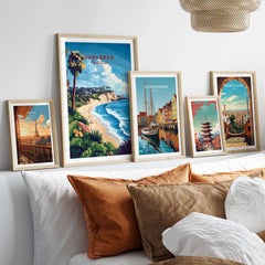 Carlsbad Wall Art showcasing vibrant coastal scenes in stylish frames on a bed with decorative pillows.