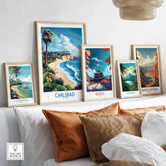 Carlsbad Wall Art Print displayed alongside other travel art prints on a cozy sofa.