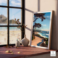 Carmel-by-the-Sea Poster Print displayed in a cozy indoor setting with coastal views.