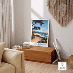 Carmel-by-the-Sea Wall Art Print displayed in a cozy living room setting with beach scenery.