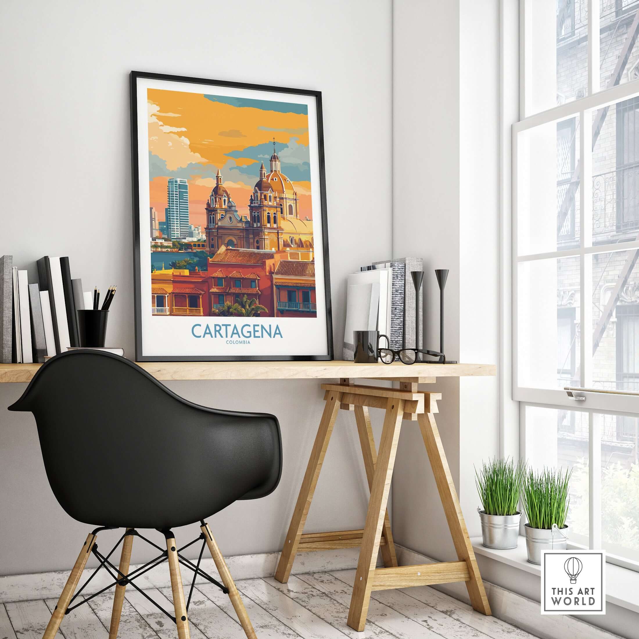 Cartagena Colombia Art Print | Walled City Travel Poster displayed in a modern workspace with vibrant colors and architecture.