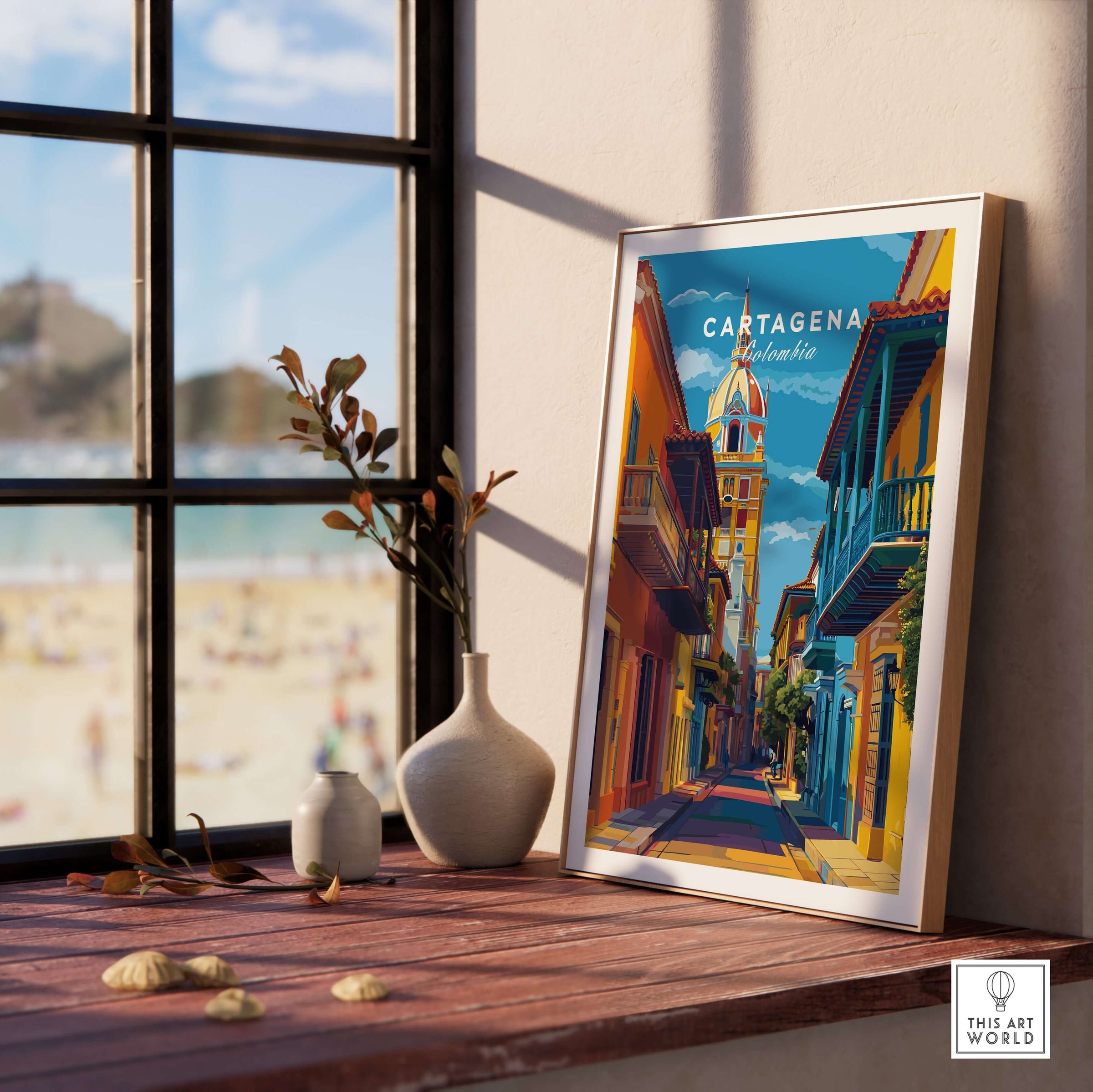 Cartagena Old Town View Print | Caribbean Architecture Wall Art displayed on table with ocean view in the background.