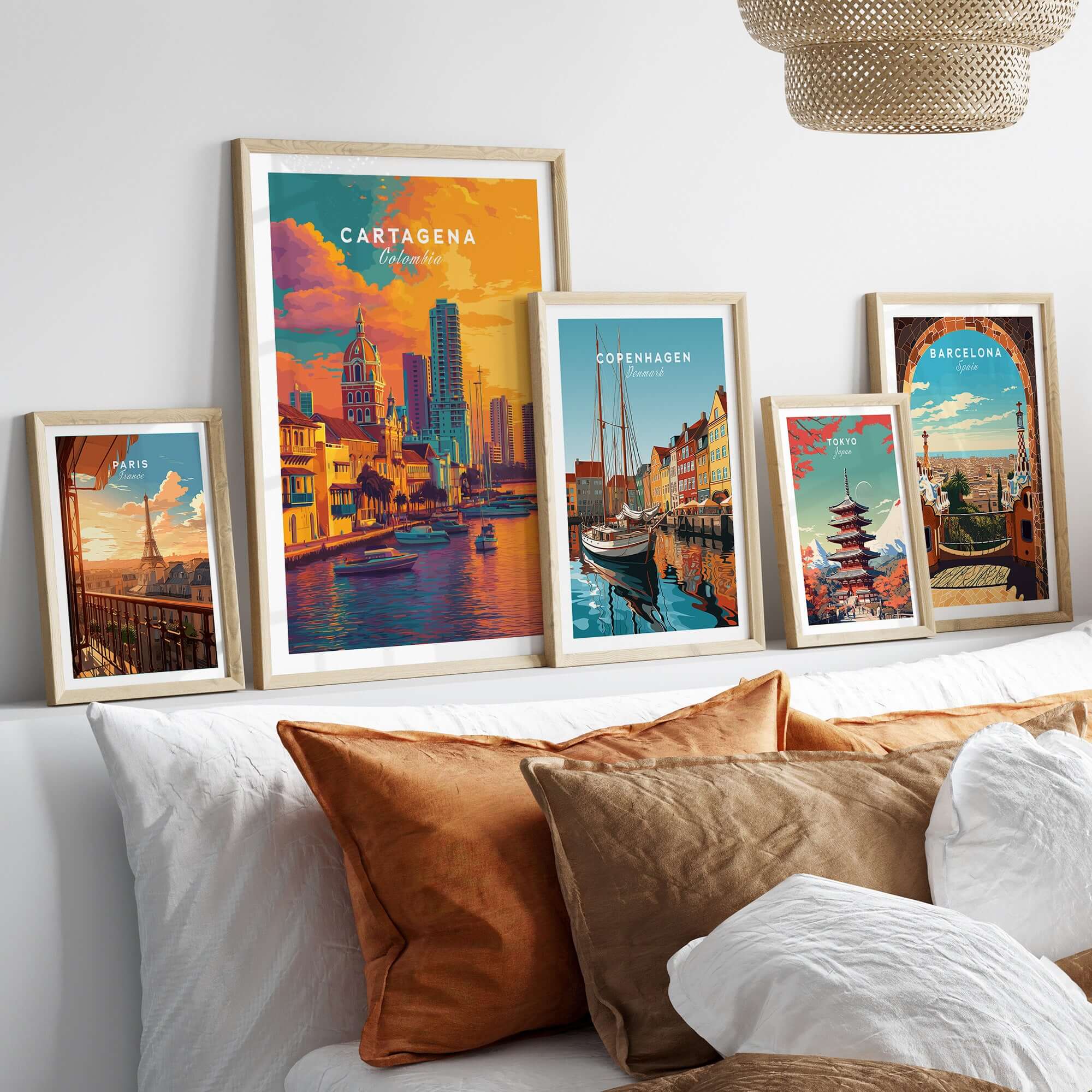 Cartagena Vibrant Tropical City View Print | Caribbean Travel Wall Art displayed among other travel prints on a cozy sofa.