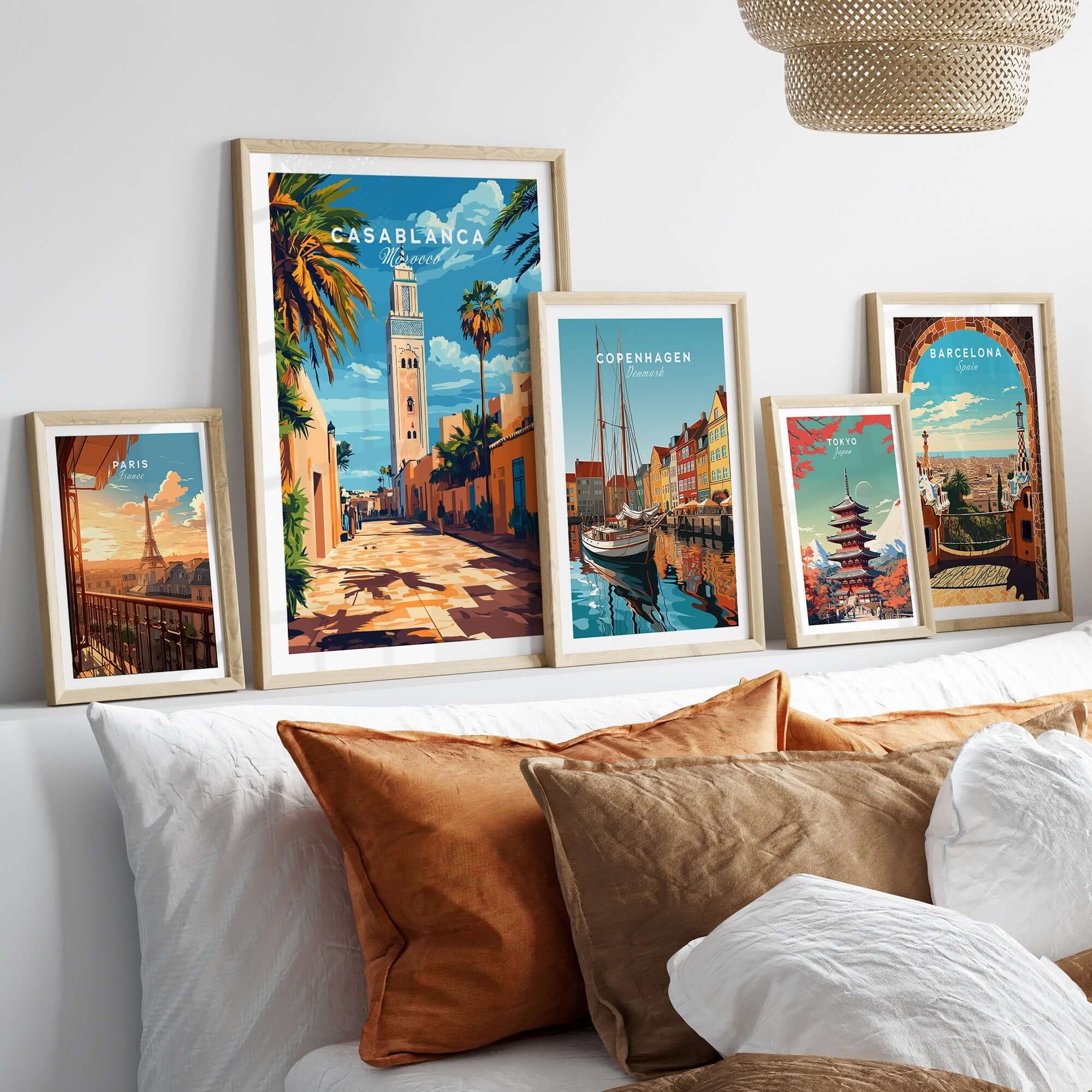 Casablanca Travel Print displayed among other travel posters above a stylish bed, adding vibrant decor.