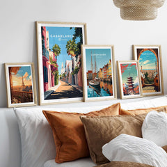Casablanca Wall Art Print displayed among other vibrant travel-themed prints on a cozy bed.