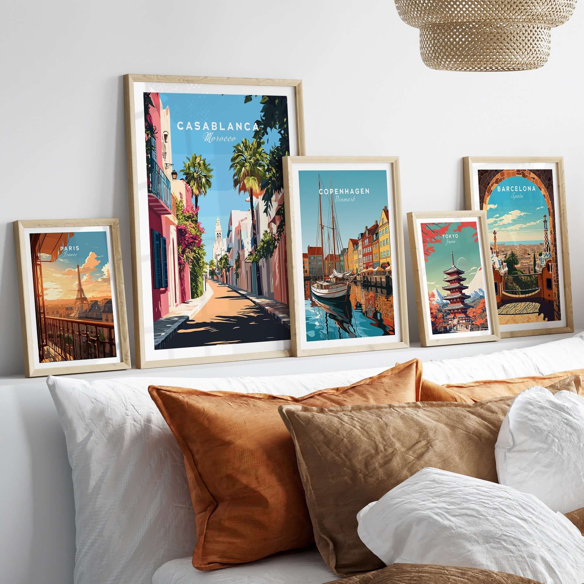 Casablanca Wall Art Print displayed among other vibrant travel-themed prints on a cozy bed.