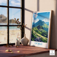 Cat Bells Art Print - Lake District displayed in a stylish frame on a wooden table by a window.