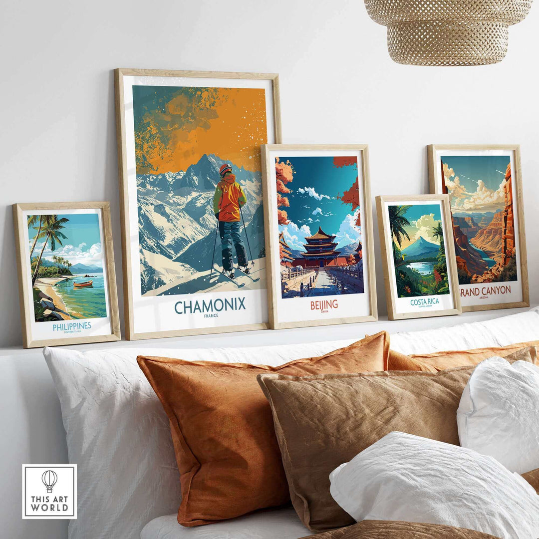 Collection of framed travel posters including Chamonix, Beijing, and Grand Canyon displayed above a sofa.