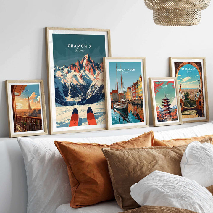 Chamonix Ski Poster and travel posters displayed above a bed, showcasing stunning locations like the French Alps, Copenhagen, and Barcelona.