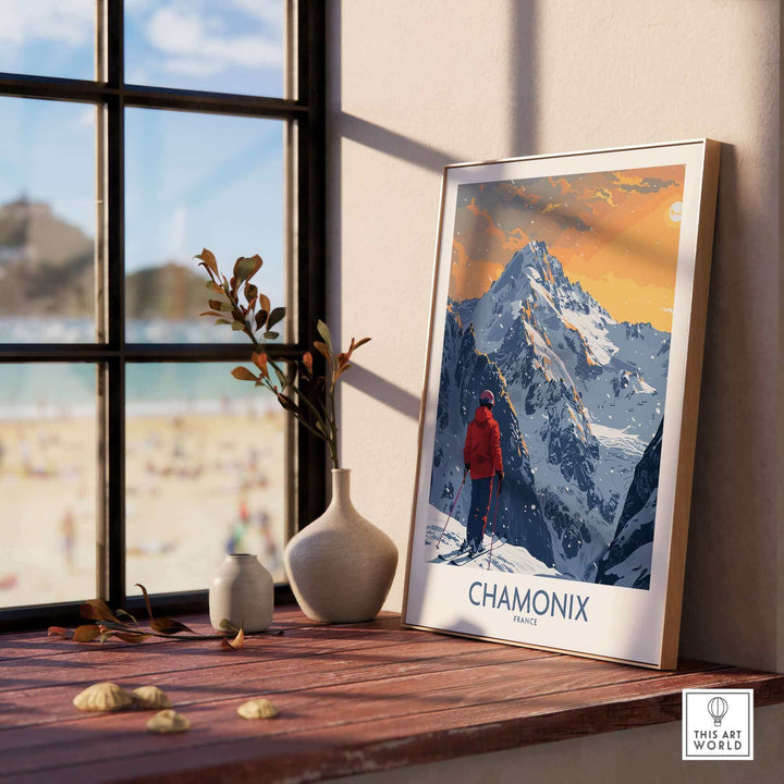 Chamonix ski print displayed by a window, showcasing the stunning French Alps and a skier in a red jacket.