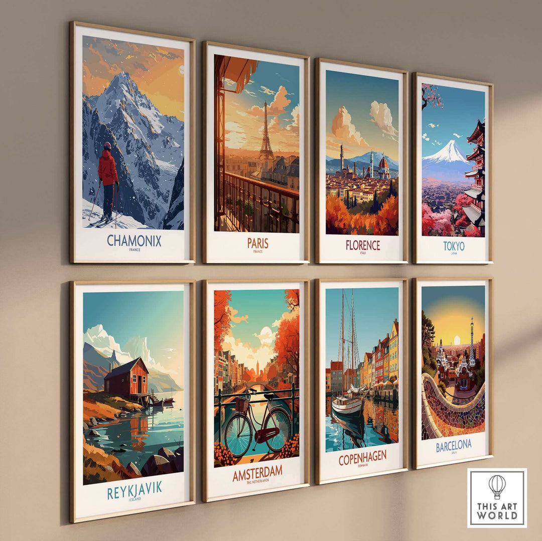 Colorful travel art prints of Chamonix, Paris, Florence, Tokyo, Reykjavik, Amsterdam, Copenhagen, and Barcelona on a wall.