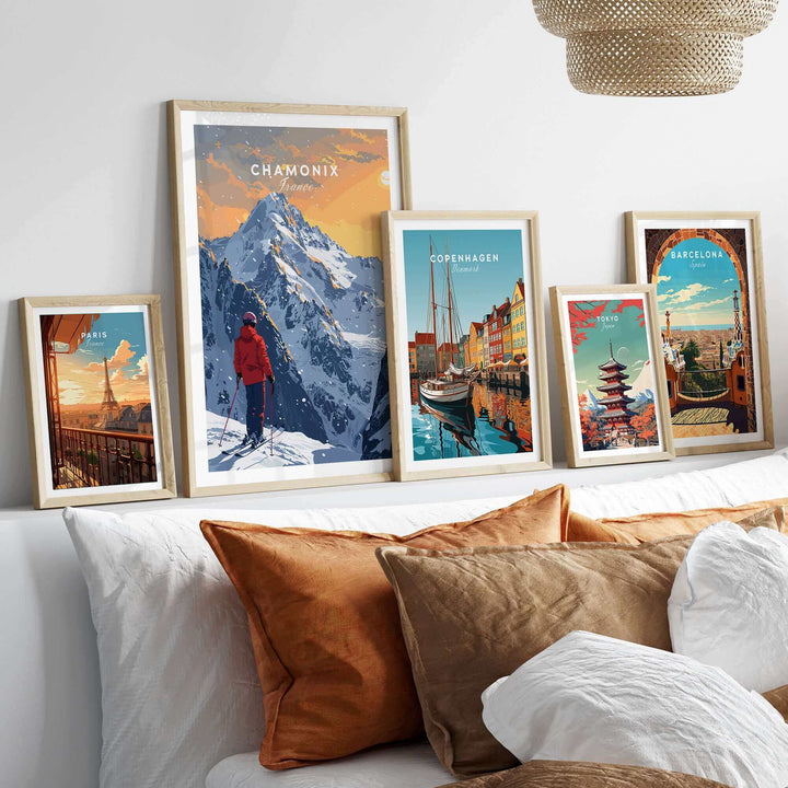 Chamonix travel poster displayed among other city posters in a stylish room with cozy decor. Perfect for winter getaway inspiration.