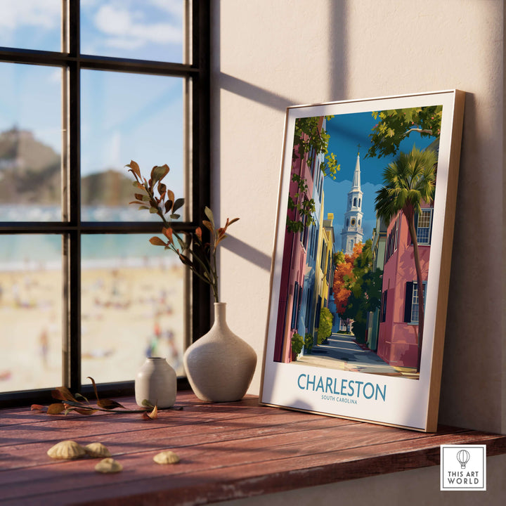 Charleston SC Rainbow Row Art Print | Historic City Street Poster displayed in a sunny interior with a beach view.