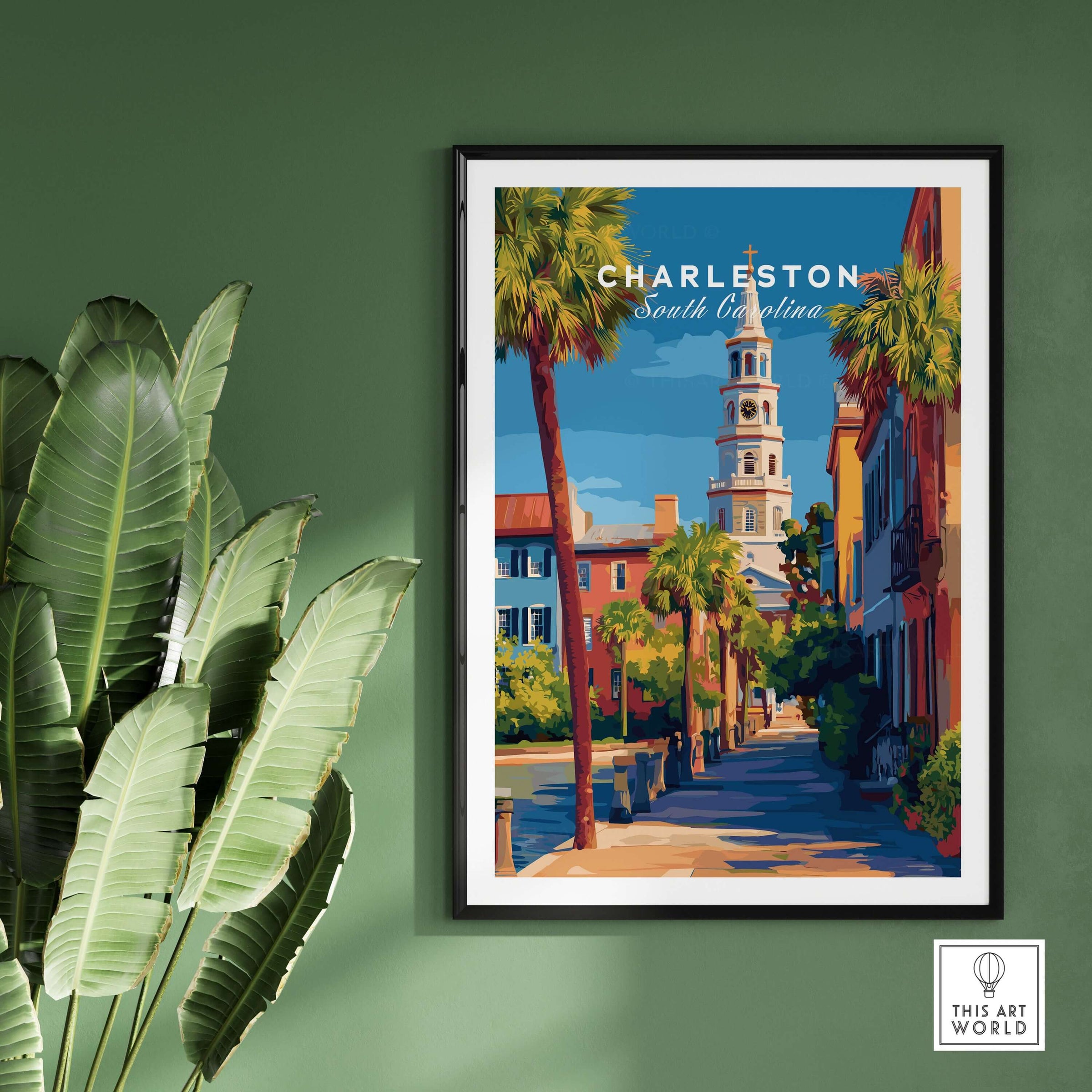 Charleston St. Michael's Church View Print | South Carolina Wall Art displayed on a green wall with palm leaves.