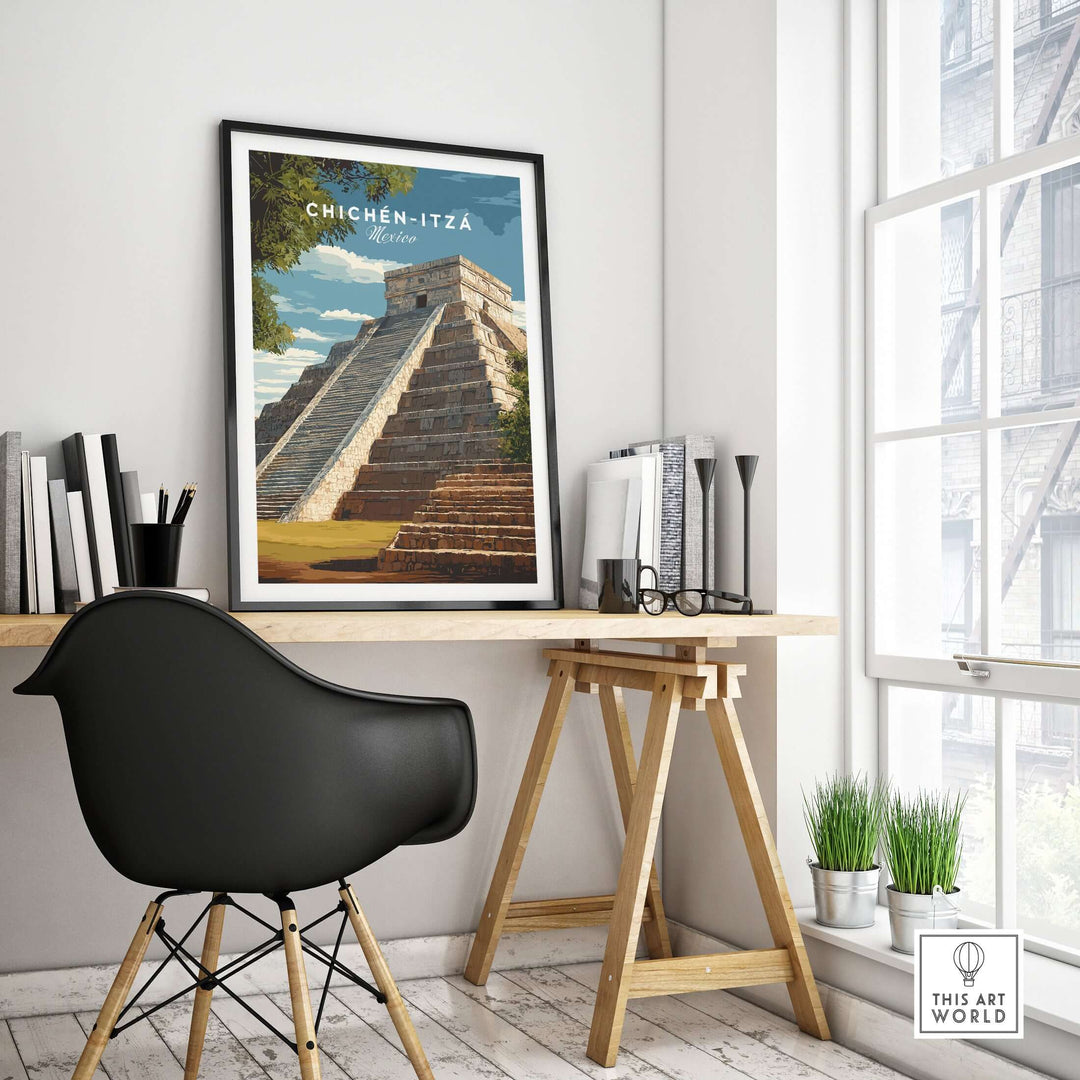 Chichén Itzá travel print of El Castillo pyramid framed in a modern workspace with a stylish chair and natural light.
