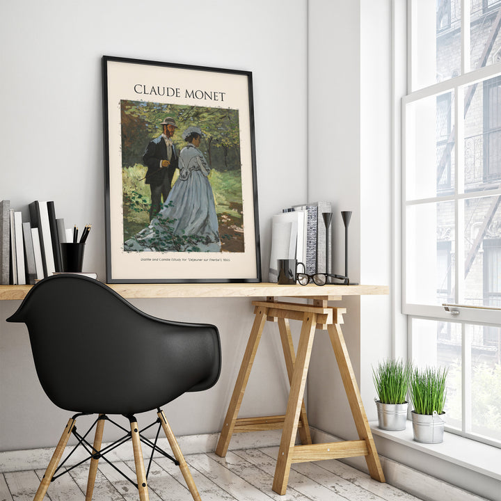Interior featuring a Claude Monet art print in a modern workspace with black chair and natural light.