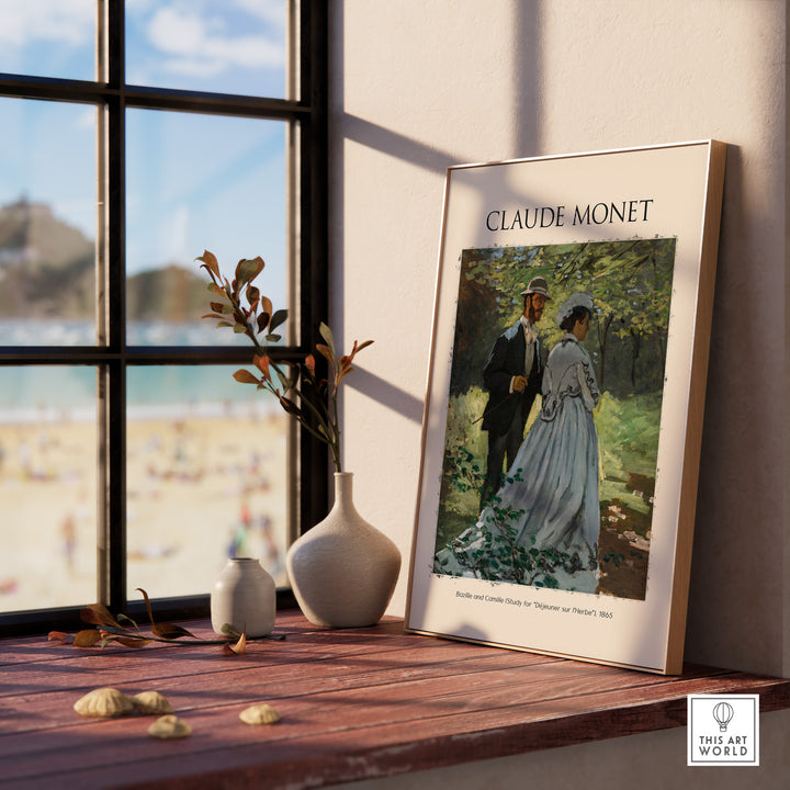 Impressionist poster of Claude Monet's 'Déjeuner sur l'Herbe' displayed in a bright room by a window.