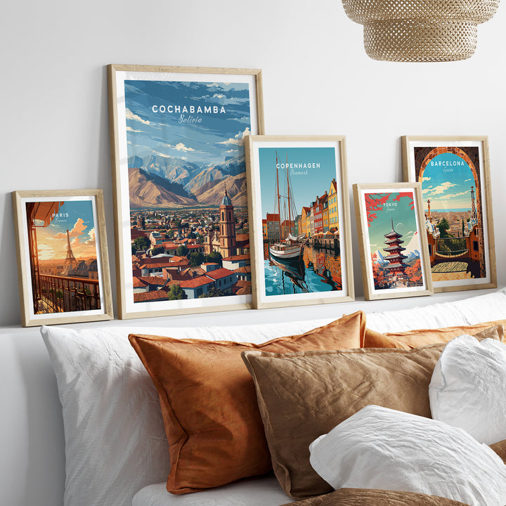 Cochabamba Bolivia mountain city poster among other travel art prints on a decorative shelf.