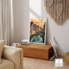 Colmar Art Print displayed in a cozy living room setting, featuring vibrant colors and charming street view of Colmar, France.